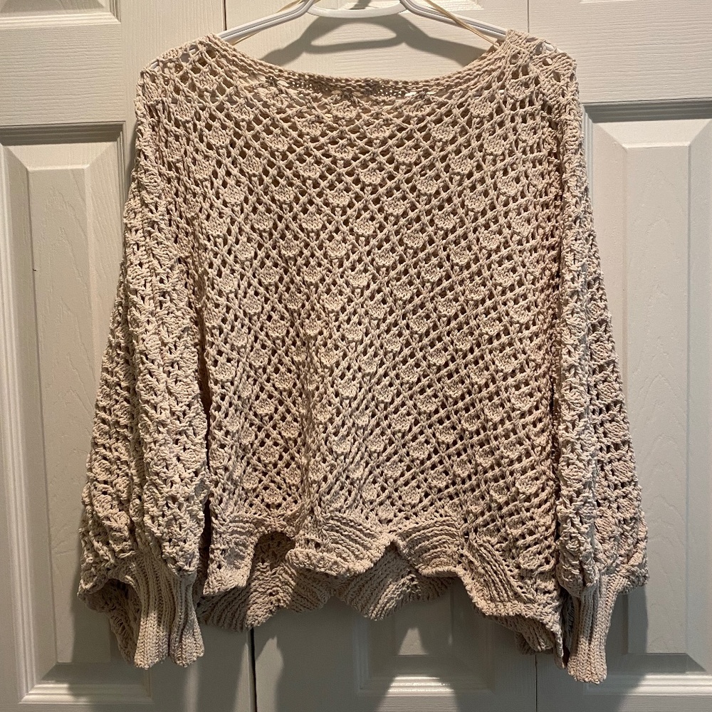 Cream coloured knit poncho